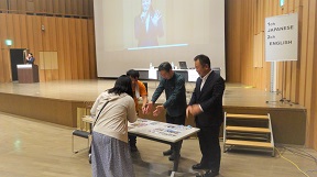 Participants receiving prizes after the quiz competition ends